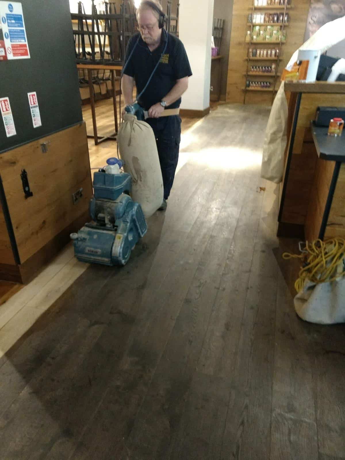 Sanding the floor at Starbucks Manchester